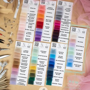 May include: A color chart of soft and matte bridal tulle fabric in various colors, including white, ivory, peach, coral, orange, red, pink, blue, green, and more. The chart is labeled "Clouds Soft & Matte Bridal Tulle Fabric" and features the brand name "Secret Spark Fabrics".