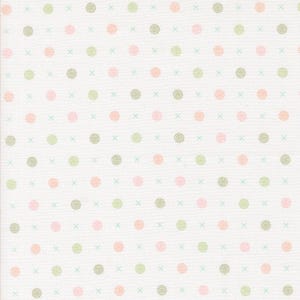 May include: White fabric with a repeating pattern of small green, pink, and peach circles. The circles are arranged in a grid pattern with a small white cross between each circle.