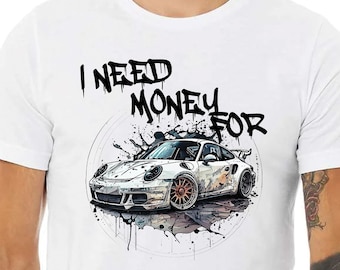 May include: White t-shirt with a black graphic print of a white sports car with the text "I NEED MONEY FOR" above it.