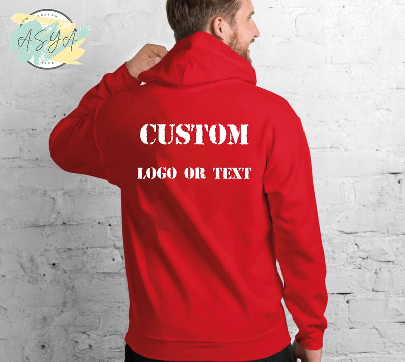 May include: Red hooded sweatshirt with the text "CUSTOM LOGO OR TEXT" printed on the back.