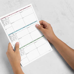 May include: A white medical patient information form printed on paper, featuring three distinct sections with pink, blue, and green headers. The document includes fields for patient details, medical history, and notes, organized in a grid layout.