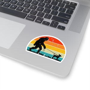 Sasquatch Bigfoot Walking a Dog Vinyl Sticker | Indoor Outdoor | 2x2, 3x3, 4x4 Inch Options