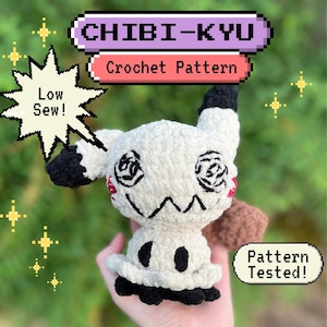 May include: A handmade white and black crochet doll with embroidered facial features and a brown tail. The doll has the text "CHIBI-KYU Crochet Pattern" and "Low Sew!" and "Pattern Tested!" in the image.