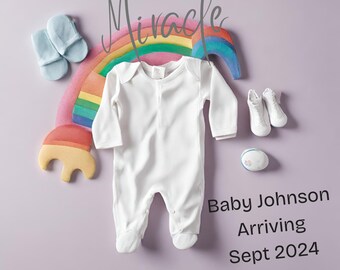 May include: A white baby onesie with a rainbow and the word "Miracle" above it. The text "Baby Johnson Arriving Sept 2024" is below the onesie.