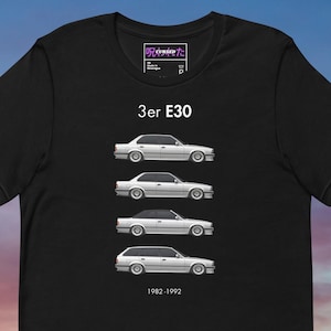 May include: Black t-shirt featuring a graphic of a silver car in four different body styles. The text "3er E30" is above the car illustrations, with "1982-1992" below. A small logo is at the top.