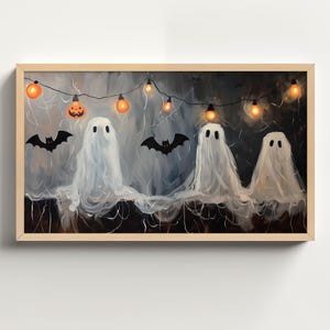 May include: A painting of four white ghosts with black eyes and mouths, hanging from a string of lights with orange bulbs. Two black bats are flying above the ghosts. The background is a dark blue with white spiderwebs.