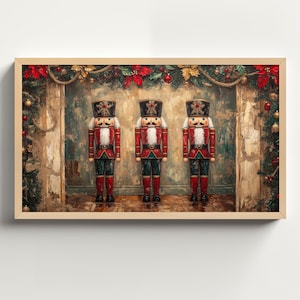 May include: Three wooden nutcracker figurines stand in a row against a backdrop of a rustic fireplace and Christmas greenery. The nutcrackers are dressed in red and gold uniforms with black hats and white faces.
