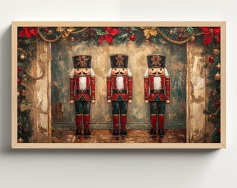 May include: Three wooden nutcracker figurines stand in a row against a backdrop of a rustic fireplace and Christmas greenery. The nutcrackers are dressed in red and gold uniforms with black hats and white faces.