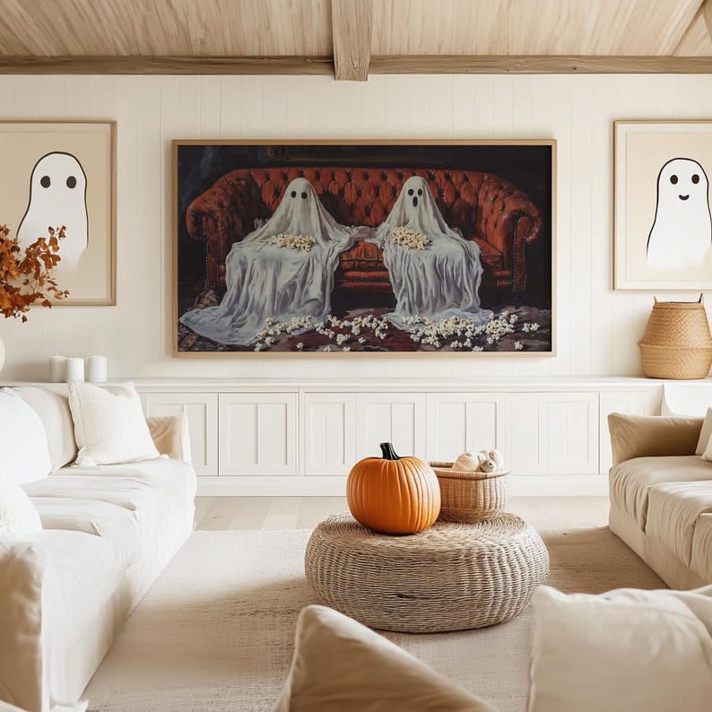 a living room filled with furniture and a painting on the wall