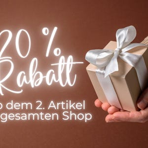 May include: A beige gift box with a white satin ribbon and bow is held in a person's hand. The image has text that reads "20% off" in a cursive font. The background is a solid brown color.