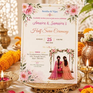 May include: A rectangular invitation card for a Half Saree Ceremony featuring pink floral illustrations at the top and bottom corners. The text includes names, date, time, and venue details, with a central graphic of two people on a swing.