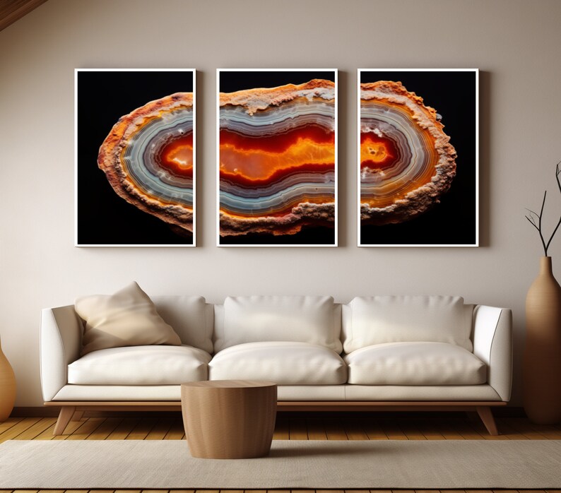 May include: Three framed prints of a colourful agate slice with a black background. The agate has a variety of colours, including red, orange, yellow, and white.