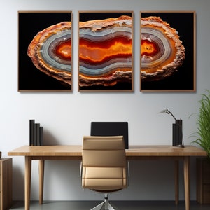 May include: Three framed prints of a cross-section of an agate geode with orange, red, and white banding against a black background.