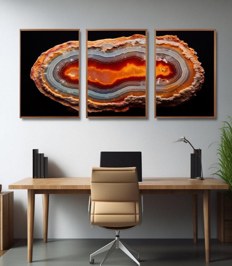 May include: Three framed prints of a cross-section of an agate geode with orange, red, and white banding against a black background.
