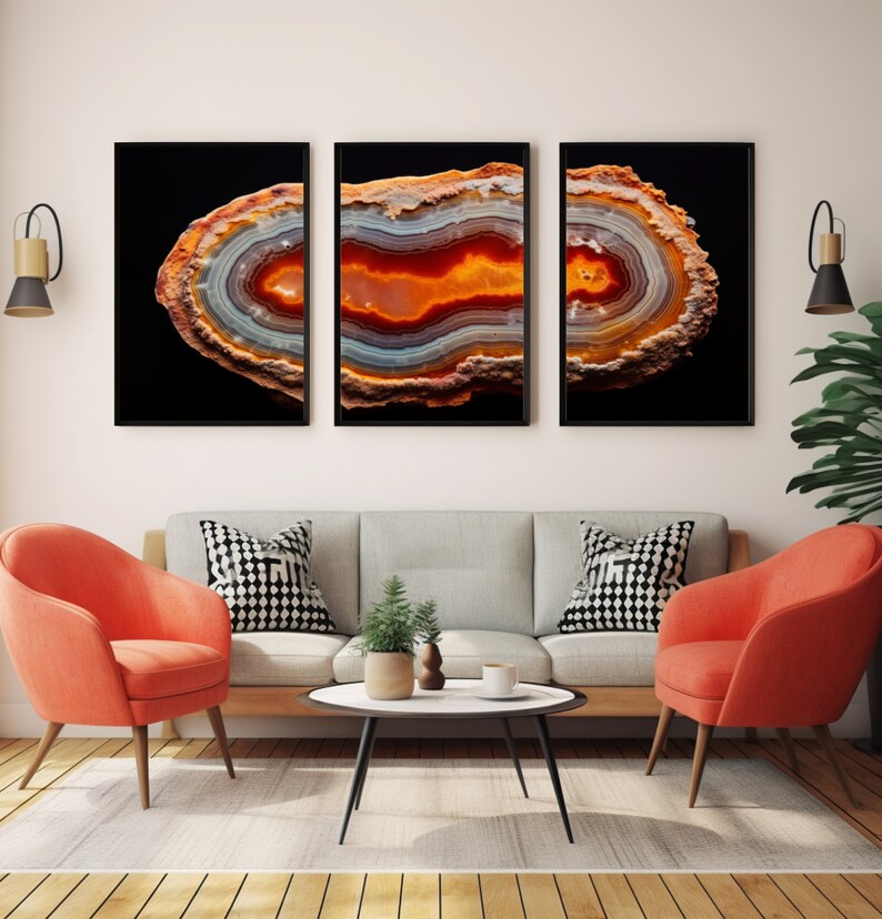 May include: Three framed prints of agate slices with a black background. The agate slices are a mix of orange, red, white, and grey colours.