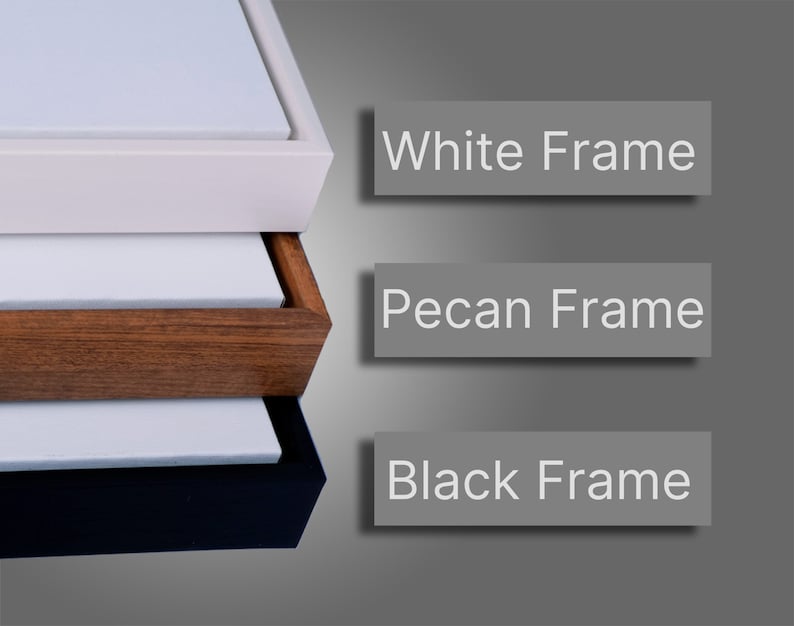 May include: Three canvas prints with different coloured frames. The top frame is white, the middle frame is pecan, and the bottom frame is black.