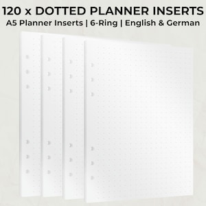 Könnte beinhalten: Vier weiße A5-Planereinlagen mit einem gepunkteten Rastermuster. Die Einlagen sind für einen 6-Ring-Ordner konzipiert und tragen den Text "120 x Dotted Planner Inserts" und "English & German".