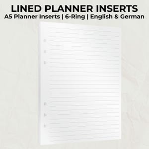 Könnte beinhalten: Weiße, linierte A5-Planereinlagen mit dem Text "LINED PLANNER INSERTS" und "A5 Planner Inserts | 6-Ring | English & German". Die Seiten sind für einen 6-Ring-Ordner vorgestanzt. Die Linien sind gleichmäßig verteilt.