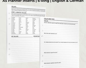 May include: White A5 planner inserts with the title "VALUES" in bold black letters. The inserts are designed for a 6-ring binder and include sections for identifying and prioritizing personal values. The text is in English and German.