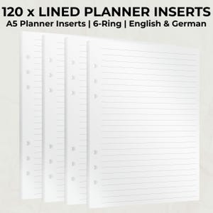 Könnte beinhalten: Vier weiße A5-Planereinlagen mit linierten Seiten. Die Einlagen sind für einen 6-Ring-Ordner konzipiert und enthalten den Text "120 x LINED PLANNER INSERTS" und "A5 Planner Inserts | 6-Ring | English & German". Die Seiten haben vorgestanzte Löcher.