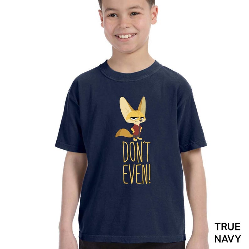 May include: Navy blue t-shirt featuring a cartoon fox with the text "DON'T EVEN!". The fox is wearing a red vest. The shirt is labeled "TRUE NAVY" in the bottom right corner.