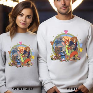 May include: Sport grey and white sweatshirts with a cartoon graphic of animal characters. The design includes various animals, flowers, and balloons. The sweatshirts are shown on a woman and a man.
