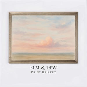 May include: A framed landscape painting depicting a tranquil sky with pastel pink and blue clouds. The artwork has a soft, dreamy quality, with a suggestion of a horizon. The text "ELM & DEW PRINT GALLERY" is printed at the bottom.