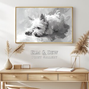 May include: Black and white painting of a dog lying down. The painting is framed in a gold frame and is hanging on a white wall. The painting is titled "ELM & DEW PRINT GALLERY".