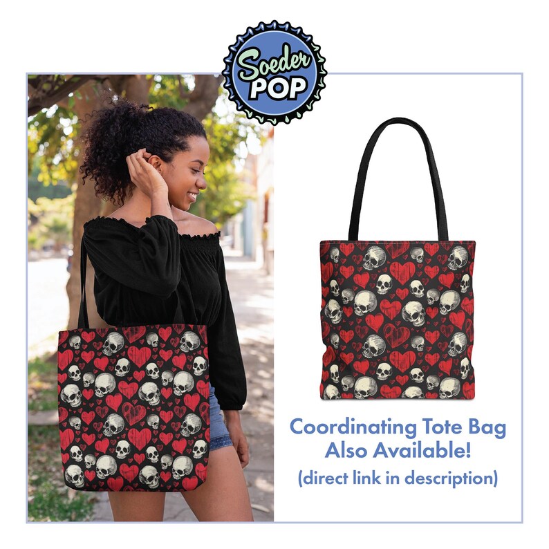 May include: A black tote bag featuring a repeating pattern of white skulls and red hearts on a dark background. The bag has two black shoulder straps and is displayed alongside text that reads Soeder POP and Coordinating Tote Bag Also Available.