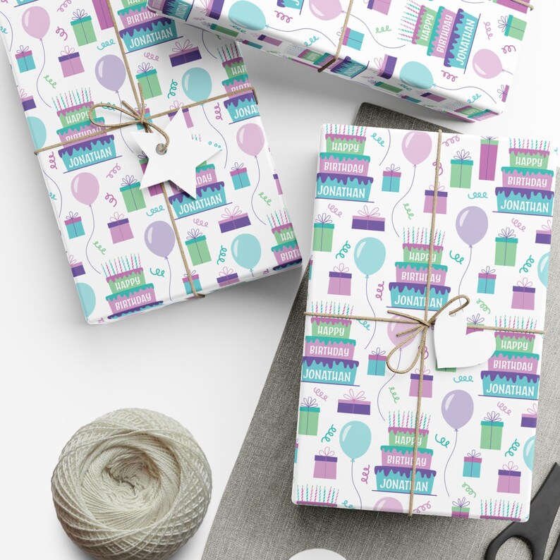 May include: White wrapping paper with a repeating pattern of colorful birthday cakes, presents, balloons, and candles. The text "Happy Birthday Jonathan" is repeated throughout the pattern.