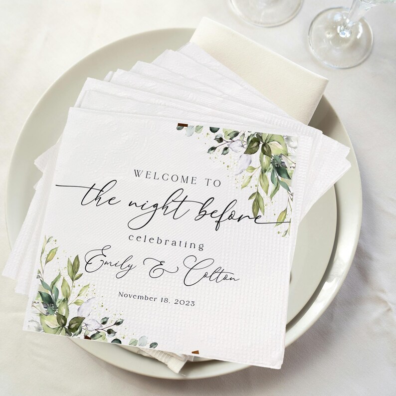 May include: White napkins with green and white floral design. Text reads "Welcome to the night before celebrating Emily & Colton November 18, 2023".