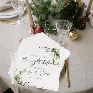 May include: White card with green and white floral design. The text reads "Welcome to the night before celebrating Emily & Colton November 18, 2023".
