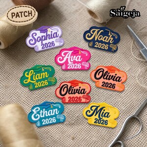 May include: A collection of colorful graduation patches with names like Sophia, Noah, and Mia, each with the year 2026. The patches feature a graduation cap design and are in various colors, including purple, green, and yellow.