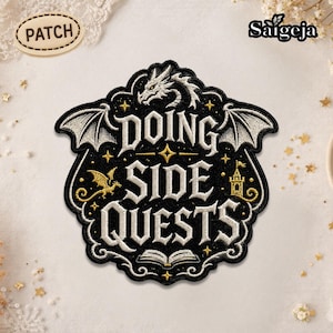May include: Embroidered patch with the words "DOING SIDE QUESTS" in a gothic font, featuring a dragon, wings, stars, and a castle. The patch is black with white and gold accents, and has a decorative border.