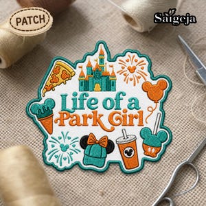 May include: Embroidered patch with the text "Life of a Park Girl" in teal and orange. The patch features a castle, pizza slice, ice cream cone, Mickey Mouse balloon, drink, and hat. The patch is surrounded by a teal border.