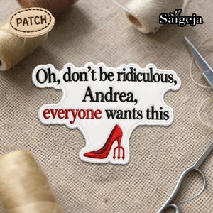May include: White embroidered patch with the text "Oh, don't be ridiculous, Andrea, everyone wants this" and a red high heel shoe with a trident. The patch is surrounded by sewing supplies.