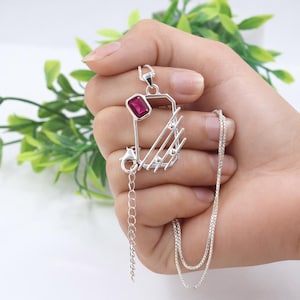 May include: A set of three ceramic mugs with a speckled, matte finish in cream, light grey, and dark grey. Each mug has a simple, minimalist design, suitable for coffee or tea.