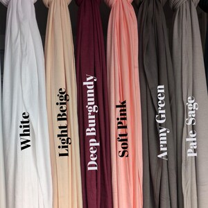 Jersey hijab for women, Muslim headscarf, soft stretchy hijab for daily wear

Plain jersey hijab, breathable modest head wrap, perfect for work or prayer

Non-slip stretch jersey hijab, easy to style Muslim head covering

Everyday jersey hijab, comfortable and elegant modest fashion accessory
