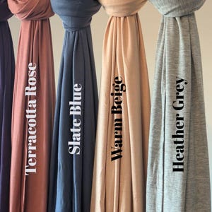 Jersey hijab for women, Muslim headscarf, soft stretchy hijab for daily wear

Plain jersey hijab, breathable modest head wrap, perfect for work or prayer

Non-slip stretch jersey hijab, easy to style Muslim head covering

Everyday jersey hijab, comfortable and elegant modest fashion accessory