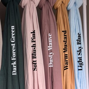 Jersey hijab for women, Muslim headscarf, soft stretchy hijab for daily wear

Plain jersey hijab, breathable modest head wrap, perfect for work or prayer

Non-slip stretch jersey hijab, easy to style Muslim head covering

Everyday jersey hijab, comfortable and elegant modest fashion accessory