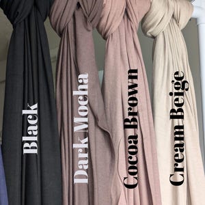 Jersey hijab for women, Muslim headscarf, soft stretchy hijab for daily wear

Plain jersey hijab, breathable modest head wrap, perfect for work or prayer

Non-slip stretch jersey hijab, easy to style Muslim head covering

Everyday jersey hijab, comfortable and elegant modest fashion accessory