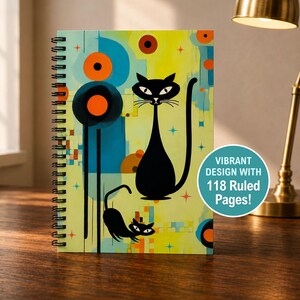 May include: A spiral-bound notebook featuring a yellow background with two black cats, blue geometric shapes, and orange circles. The cover includes the text VIBRANT DESIGN WITH 118 Ruled Pages! The design incorporates small star-like accents throughout.