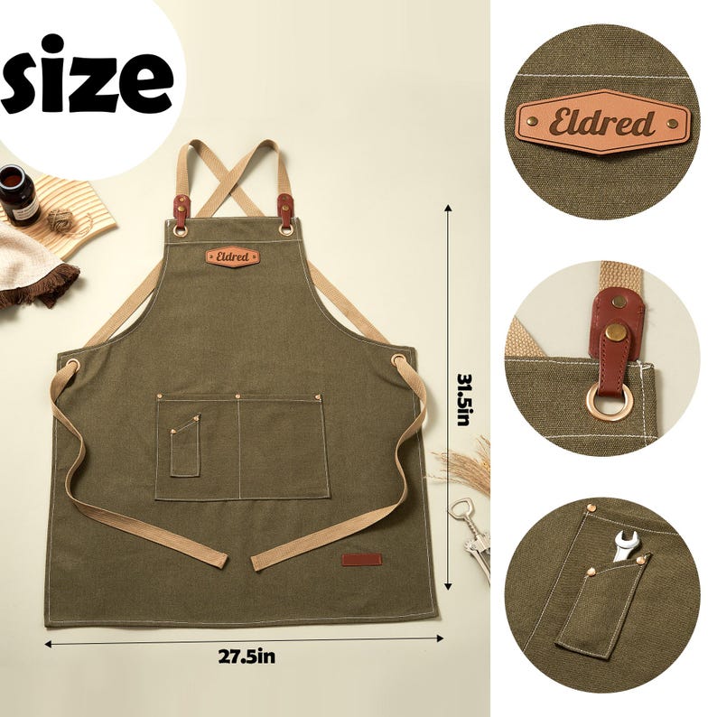 May include: An olive green apron with beige cross-back straps, a leather patch labeled Eldred, and multiple pockets. The apron measures 31.5 inches in height and 27.5 inches in width, featuring metal hardware and reinforced stitching details.