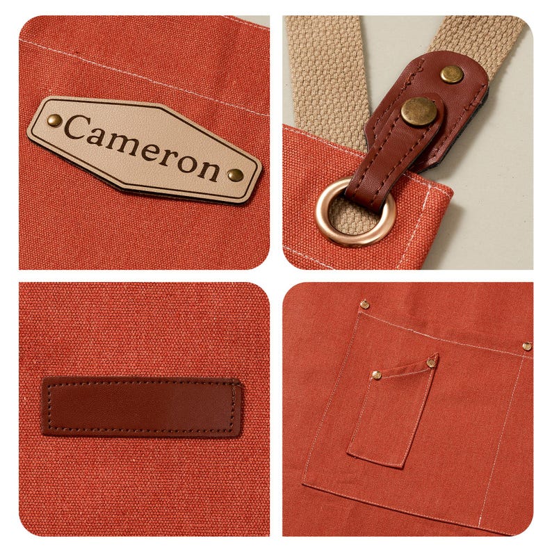 May include: A rust-colored canvas apron featuring a beige leather-like patch with the name Cameron, brown leather strap attachments with brass-toned rivets and rings, a plain rectangular brown leather patch, and a large pocket with brass-toned rivets.