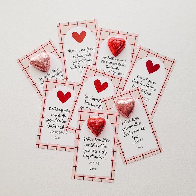 May include: A set of ten Valentine's Day cards with red and white checkered backgrounds. Each card features a different Bible verse about love, along with a chocolate heart candy.