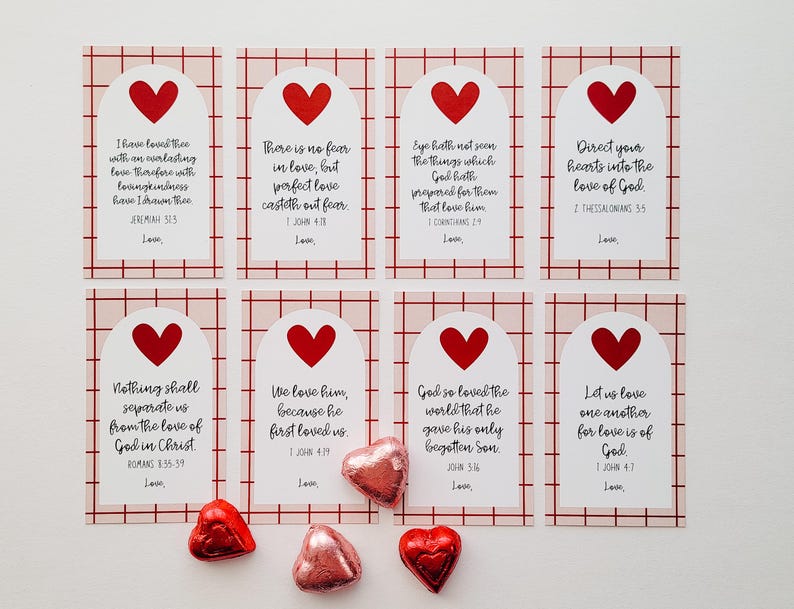 May include: Eight pink and white cards with red hearts and bible verses about love. The cards are arranged in two rows of four. The verses include "I have loved thee with an everlasting love", "There is no fear in love, but perfect love casteth out fear", "Eye hath not seen the things which God hath prepared for them that love him", "Direct your hearts into the love of God", "Nothing shall separate us from the love of God in Christ", "We love him, because he first loved us", "God so loved the world that he gave his only begotten Son", and "Let us love one another for love is of God".