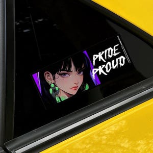 May include: A rectangular sticker featuring an anime-style illustration of a woman with black hair and purple eyes. The sticker has the words "PRIDE PROUD" in white, with a purple background. The sticker is on a black surface.