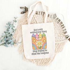 God Is Still Writing Your Story Crayon Tote Bag, Jesus Tote Bag, Mother&#39;s Day Gift, Best Friend Baptism Gift, Bible School Teacher Tote