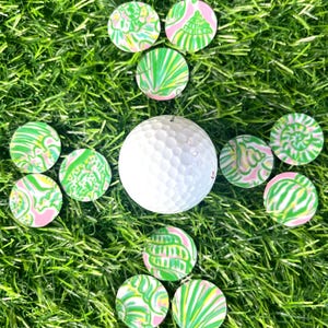 Sea Shell golf ball markers with magnetic hat clip. Ocean golf ball markers. Lilly inspired golf. Pink and green golf ball markers.