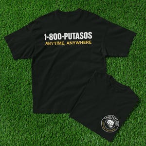 May include: Black t-shirt with white text that reads "1-800-PUTASOS ANYTIME, ANYWHERE".